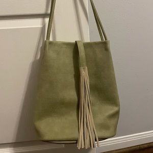 Pale green bucket bag with tassel